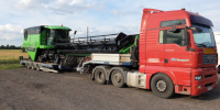 transport of combine-harvester Deutz-Fahr on semi lowloader